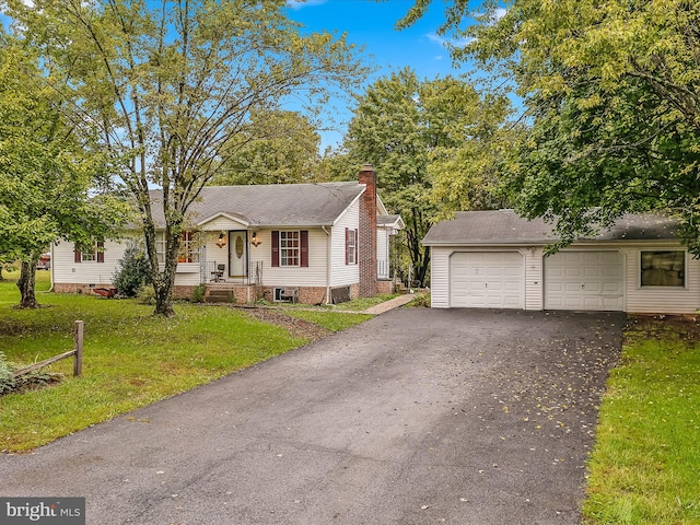 view of front of home featuring a garage and a front lawn