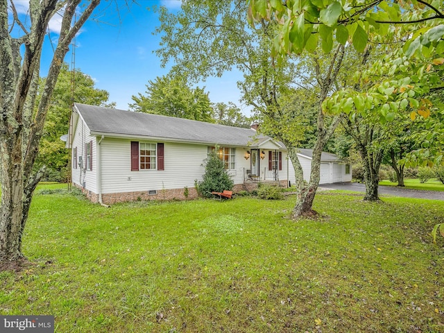 single story home featuring a garage and a front lawn