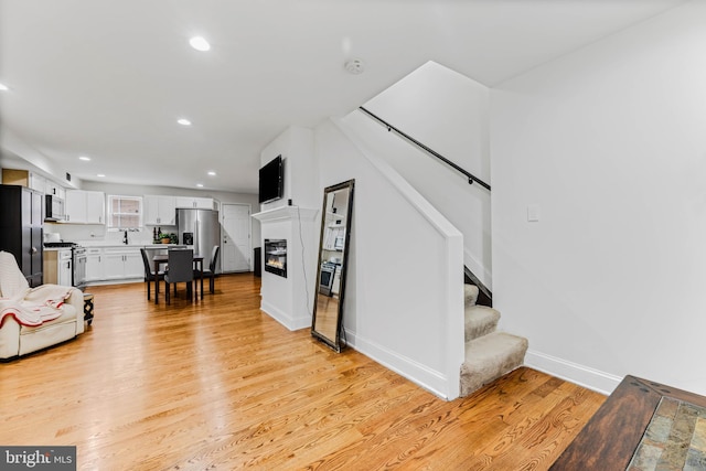 living room with light hardwood / wood-style floors