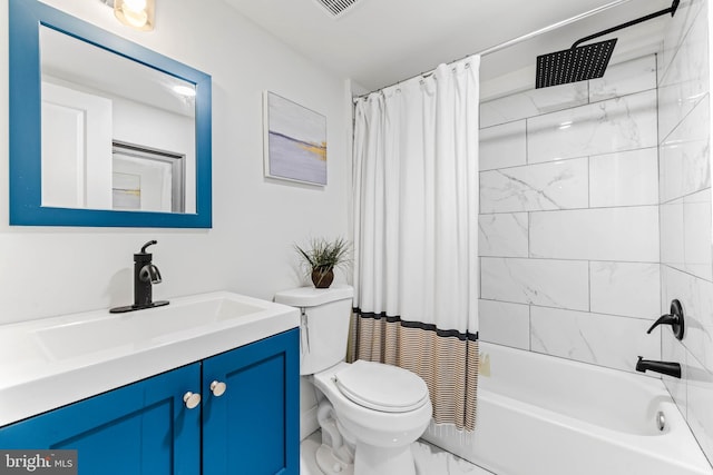 full bathroom featuring shower / tub combo with curtain, vanity, and toilet