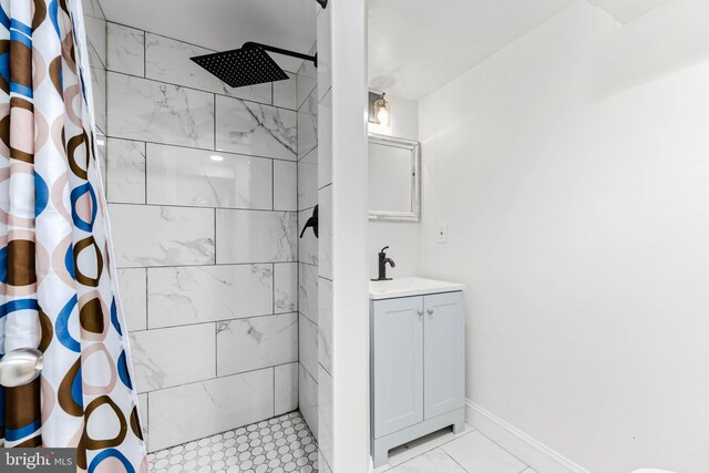 bathroom featuring vanity and a shower with shower curtain