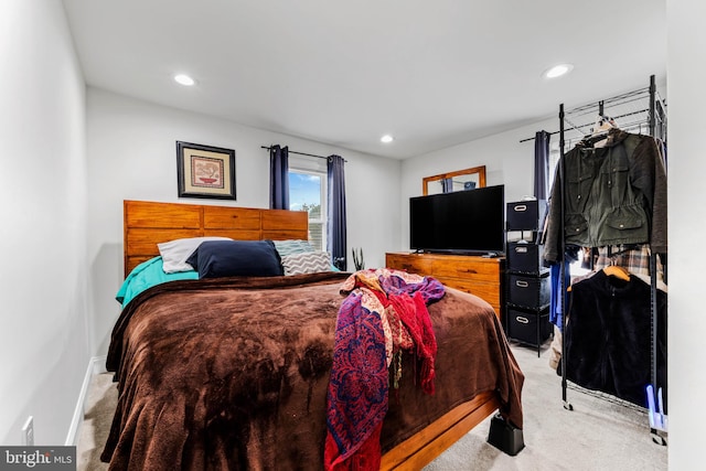 bedroom featuring light carpet