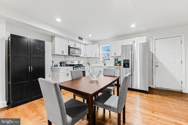 dining area featuring light hardwood / wood-style floors