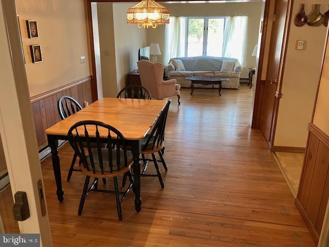 dining space with light hardwood / wood-style flooring