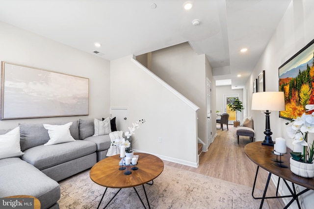 living room with light hardwood / wood-style floors