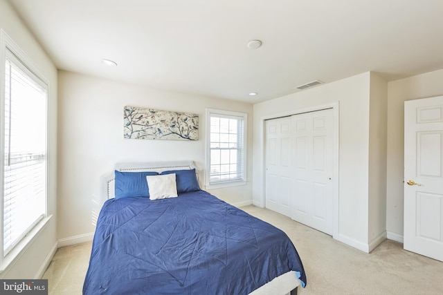 carpeted bedroom featuring a closet