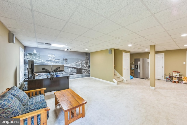 interior space with a paneled ceiling