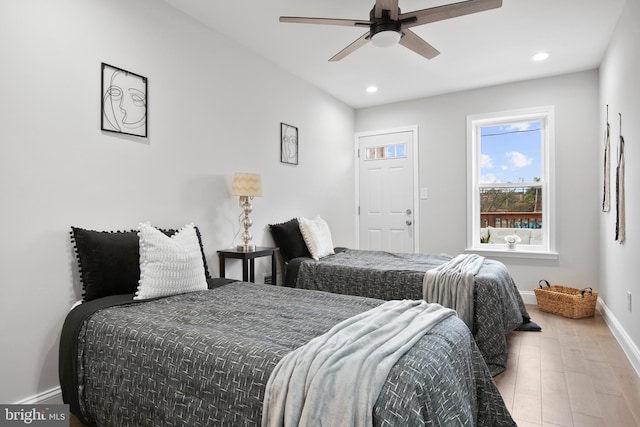 bedroom with ceiling fan and light hardwood / wood-style flooring