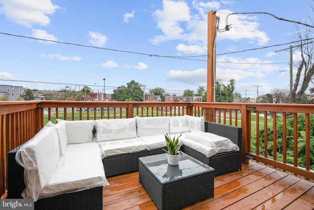 wooden terrace with an outdoor hangout area