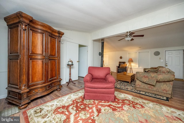 living room with lofted ceiling, ceiling fan, and hardwood / wood-style floors