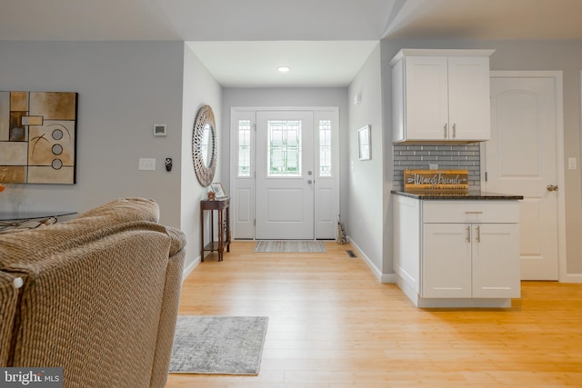 foyer with light hardwood / wood-style flooring