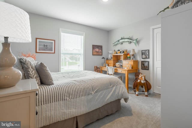 bedroom featuring light colored carpet