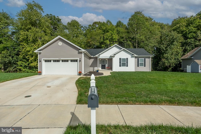 view of front of property featuring a front yard and a garage