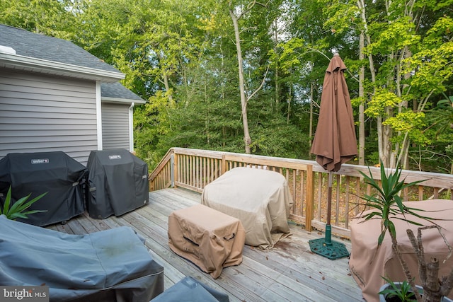 wooden terrace with area for grilling