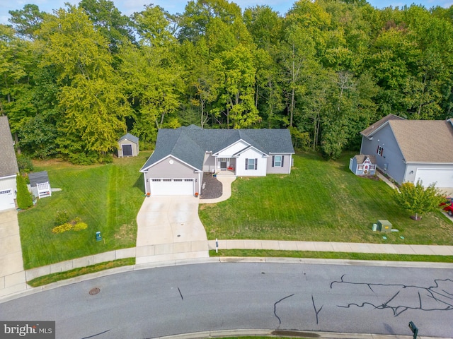 view of front facade featuring a front lawn and a garage