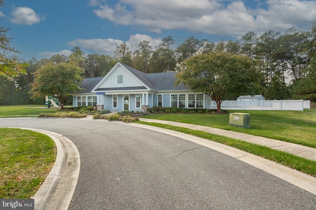 cape cod-style house with a front yard