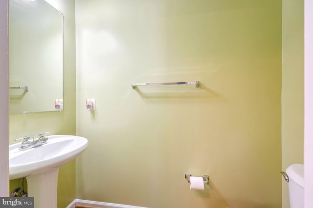 bathroom with toilet and sink