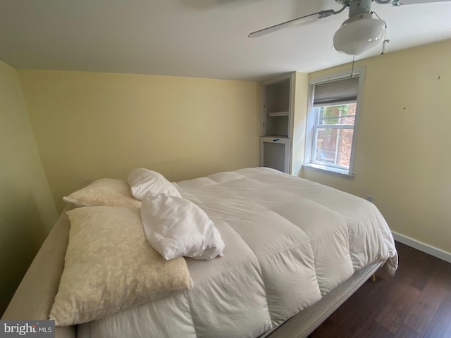 bedroom featuring dark hardwood / wood-style floors and ceiling fan