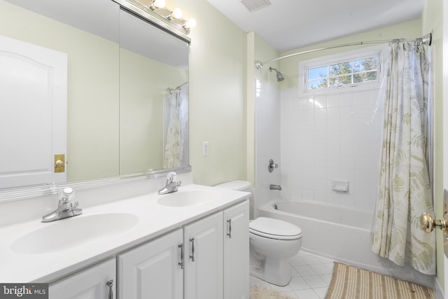 full bathroom with shower / bath combination with curtain, tile patterned floors, vanity, and toilet