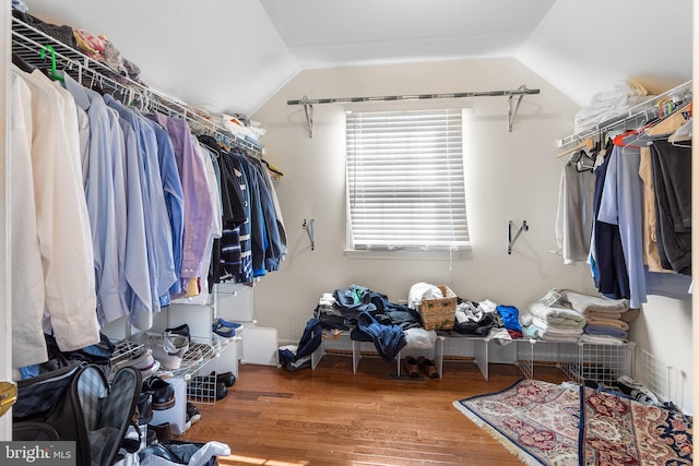 spacious closet featuring hardwood / wood-style flooring and lofted ceiling