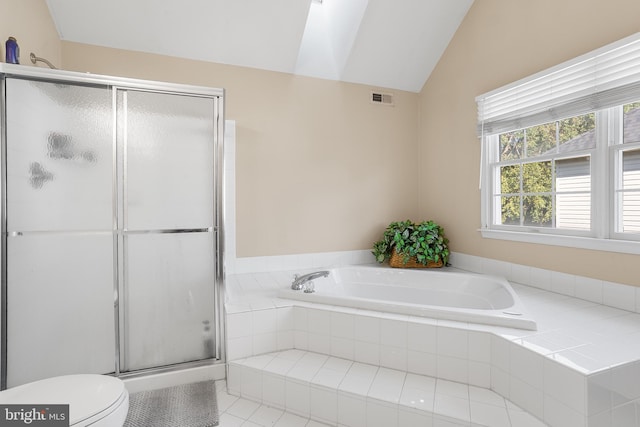 bathroom with independent shower and bath, lofted ceiling, tile patterned flooring, and toilet