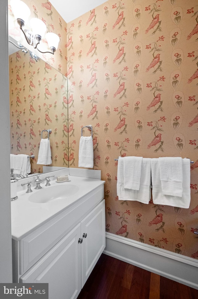 bathroom with hardwood / wood-style flooring and vanity