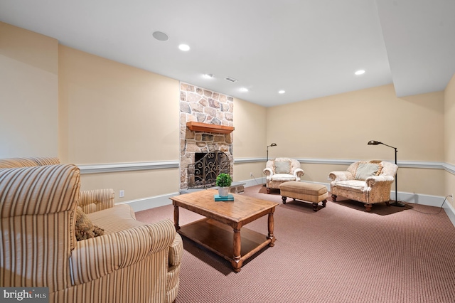 carpeted living room featuring a fireplace