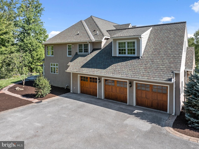 view of side of property featuring a garage