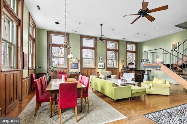 dining room featuring wood-type flooring and ceiling fan