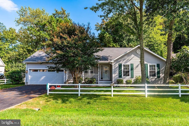 ranch-style house with a garage and a front lawn