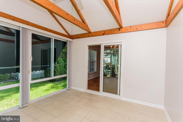 unfurnished sunroom with lofted ceiling with beams