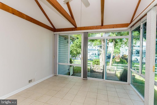 unfurnished sunroom with ceiling fan and vaulted ceiling with beams