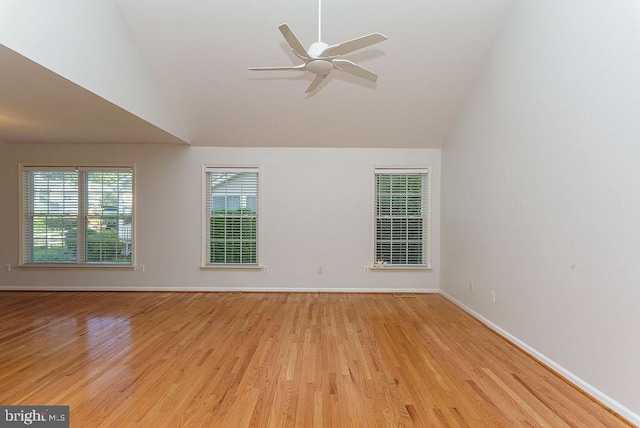 unfurnished room with ceiling fan, light hardwood / wood-style flooring, and high vaulted ceiling