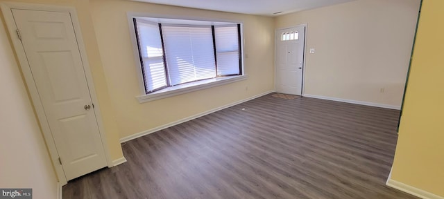 unfurnished room featuring dark hardwood / wood-style flooring