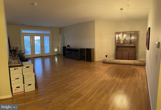 living room featuring dark hardwood / wood-style flooring and a chandelier