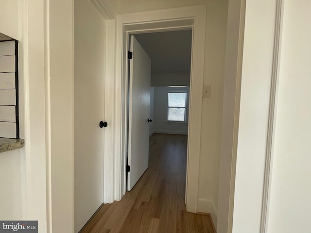 corridor featuring light hardwood / wood-style flooring