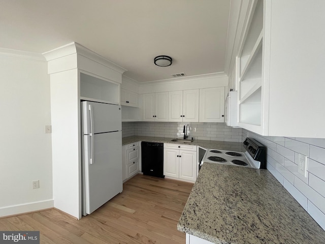 kitchen featuring dishwasher, white refrigerator, sink, electric range, and white cabinetry