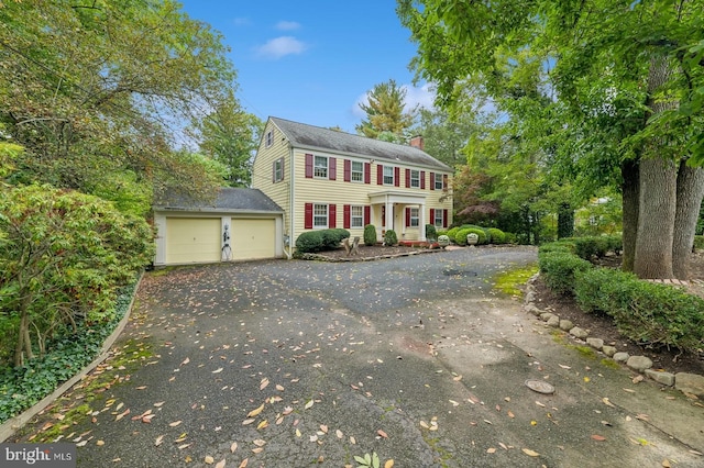 colonial inspired home with a garage