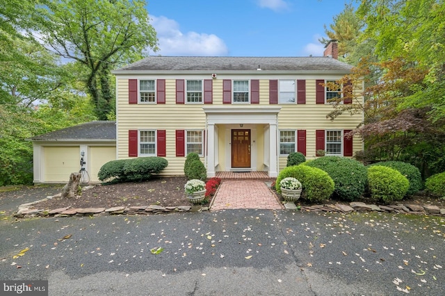 colonial house featuring a garage