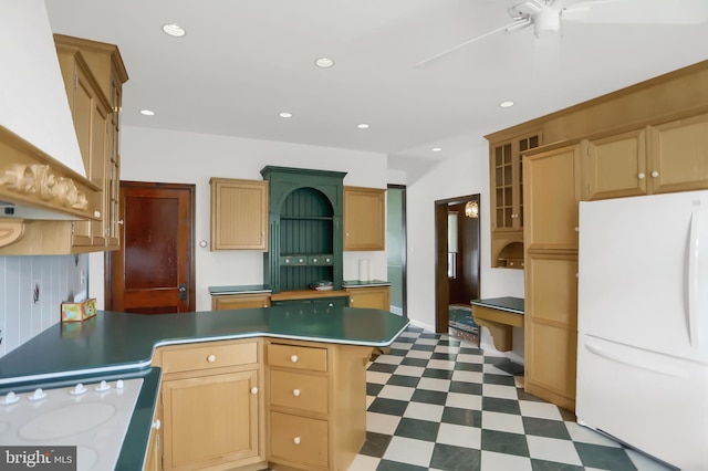 kitchen featuring custom exhaust hood, ceiling fan, a kitchen island, range, and white refrigerator