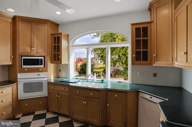 kitchen with sink and white appliances