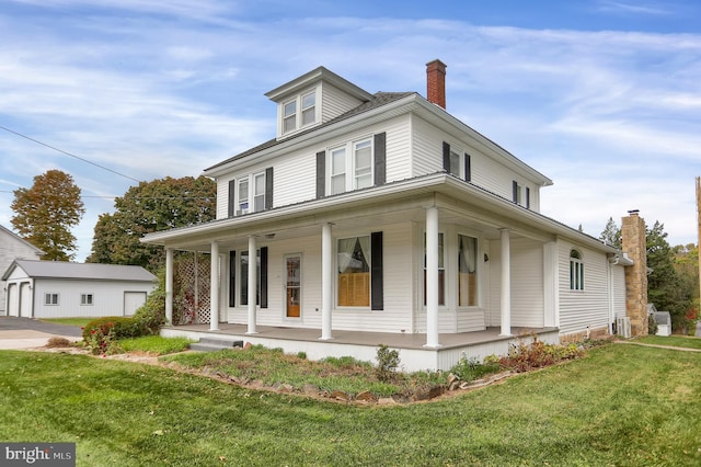 farmhouse-style home with covered porch and a front lawn