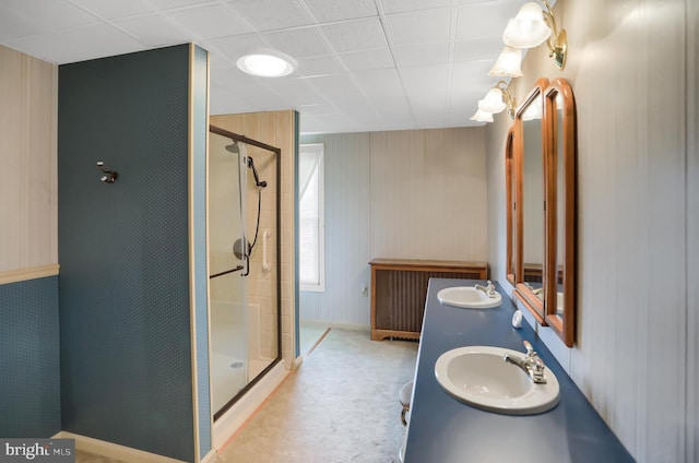 bathroom with vanity and a shower with shower door