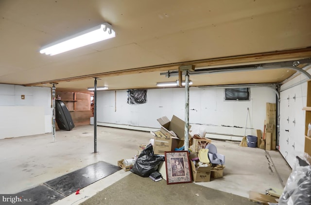 basement featuring a baseboard heating unit