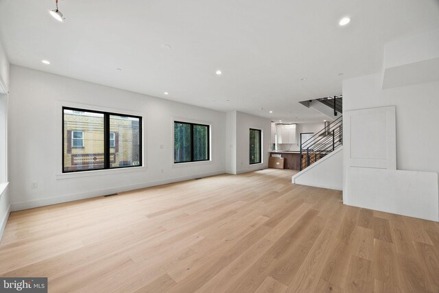 706 Latona St Unit J, Philadelphia, PA 19147 - unfurnished living room featuring recessed lighting, light wood-type flooring, baseboards, and stairs