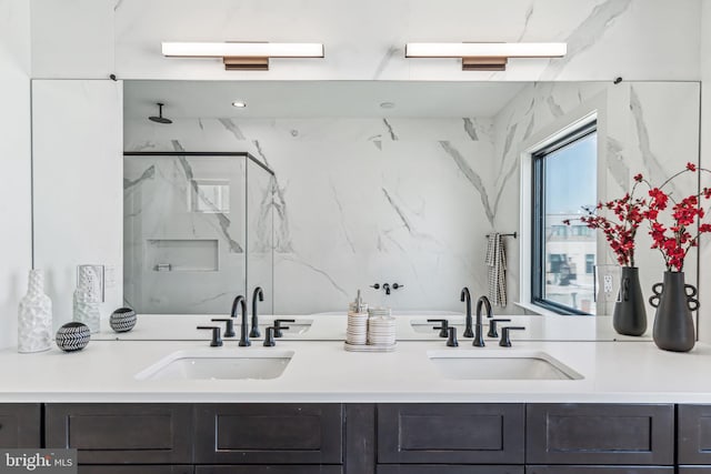 bathroom featuring vanity and a shower with shower door