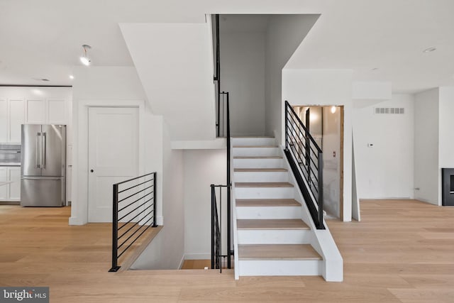 706 Latona St Unit J, Philadelphia, PA 19147 - stairway featuring wood finished floors and recessed lighting