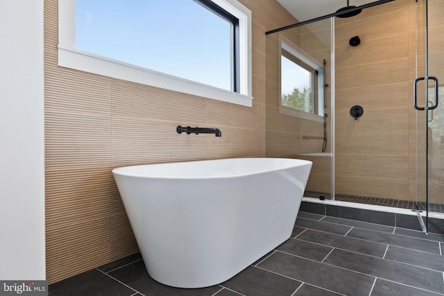 706 Latona St Unit J, Philadelphia, PA 19147 - full bath with tile patterned floors, a shower stall, and a soaking tub