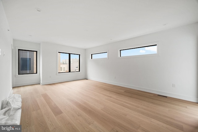 706 Latona St Unit J, Philadelphia, PA 19147 - spare room with light wood-style floors, plenty of natural light, and baseboards