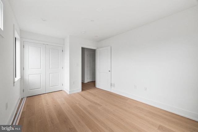706 Latona St Unit J, Philadelphia, PA 19147 - unfurnished bedroom with light wood-style floors, baseboards, and a closet